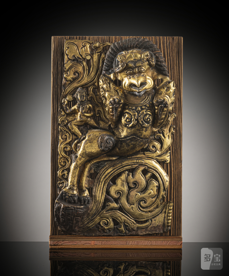 A GILT-COPPER EMBOSSED PANEL